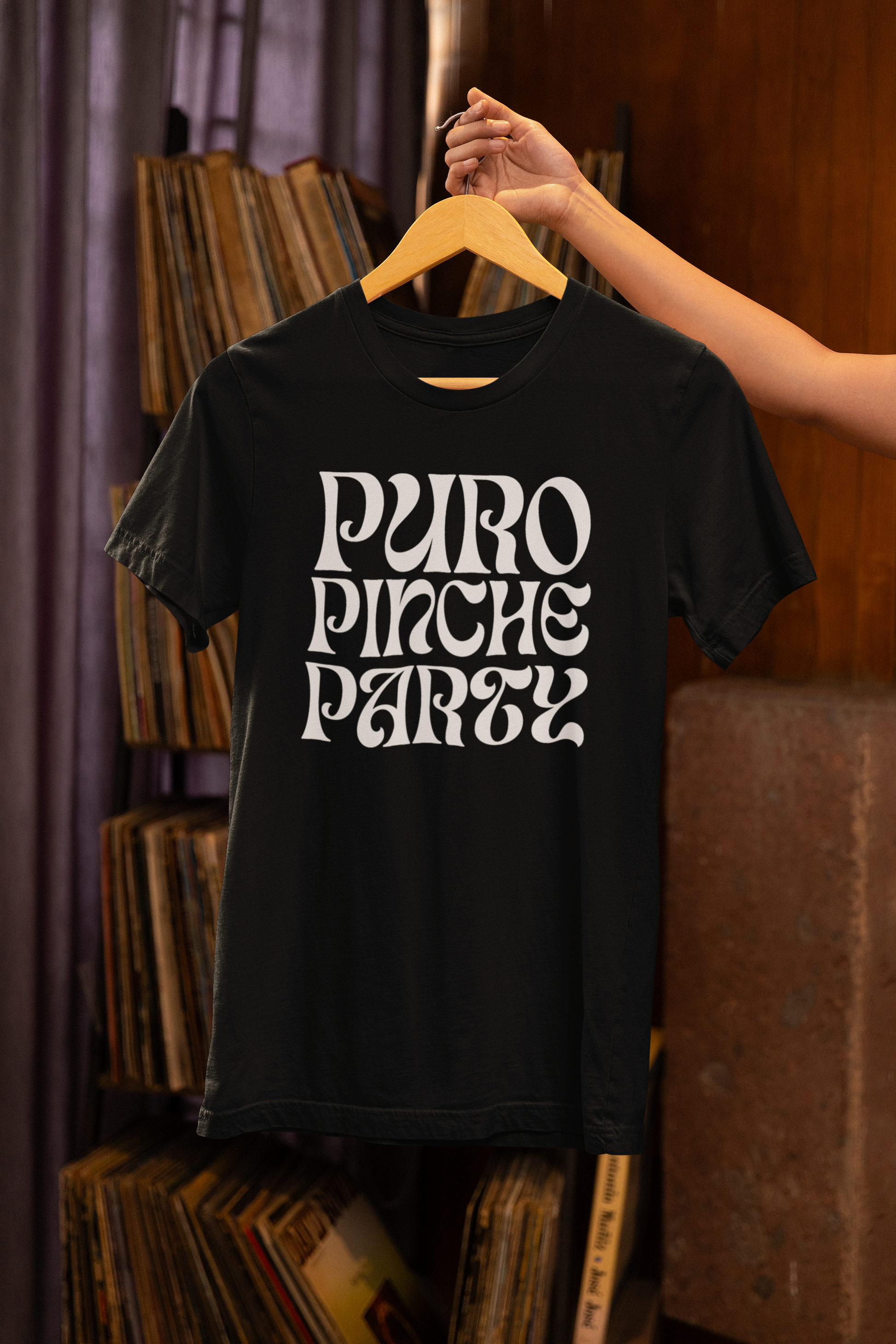 Puro Pinche Party Techno T-shirt on a hanger